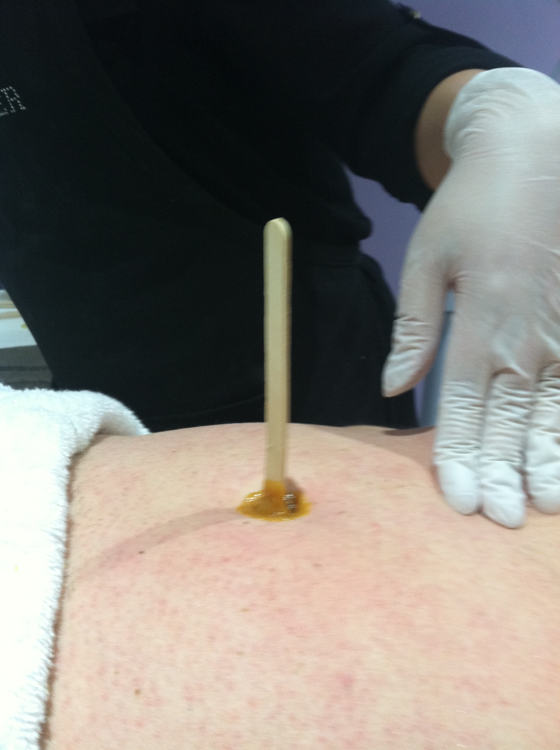 belly button waxing during waxing class | Brit of Wax and Facials